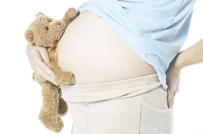 pregnant woman holding teddy bear uid 1285065.jpg