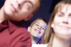 child at move theater peering through heads 0001.jpg