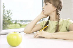 Little girl daydreaming out classroom window.jpg