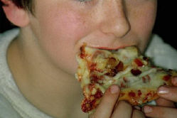 Young boy eating pizza.jpg