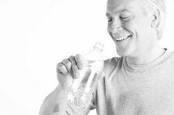 Man drinking bottle of water after workout 2.jpg