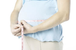 new3_Pregnant woman measuring belly.jpg