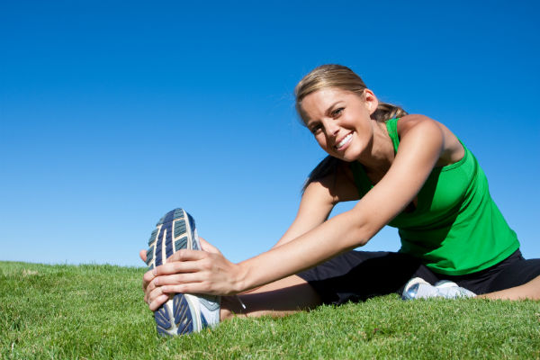 images_post_workout_stretch_green_grass_outside_nature_woman_pic.jpg