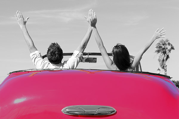 images_22112016_Happy-Couple-in-Car-arms-raised-pink-600.jpg