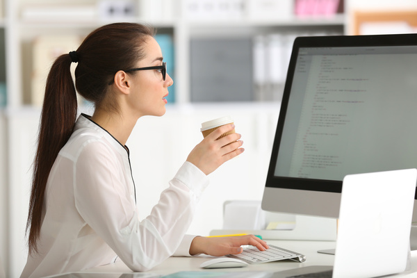 images_2272017_Working-in-the-office-Beautiful-female-programmers-drinking-coffee-Stock-Photo.jpg