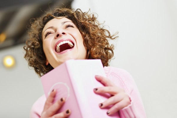 images_872017_2_woman_laughing_with_a_book_in_hand.jpg